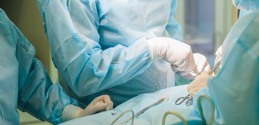 Surgical team performing surgery in hospital operating room