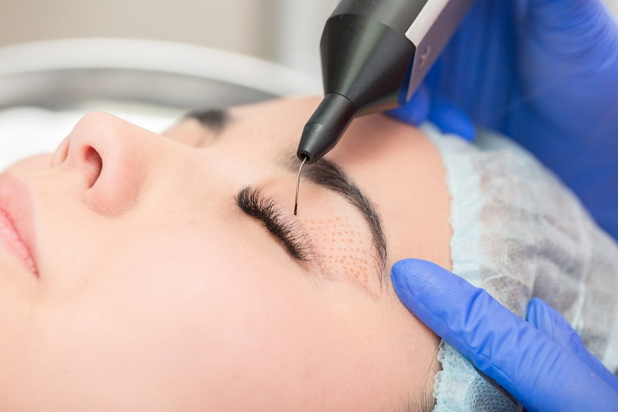 Woman getting eye treatment | Get Cosmetic treatment at Dr. Leonard Grossman M.D. | New York