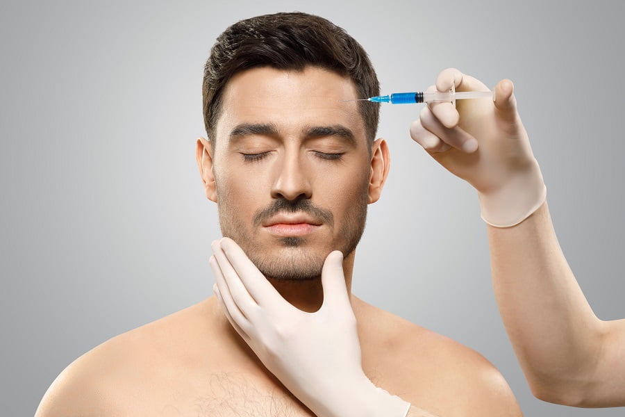 Young man getting injection to forehead | Dr. Leonard Grossman M.D. | New York