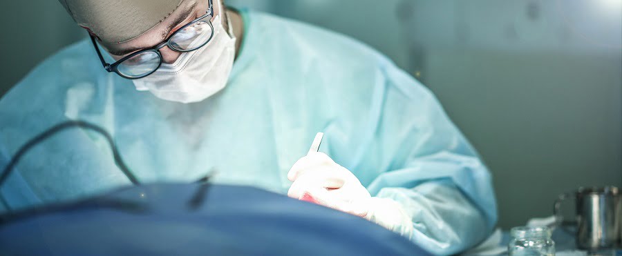 Young male plastic surgeon operates in the operating room | NY