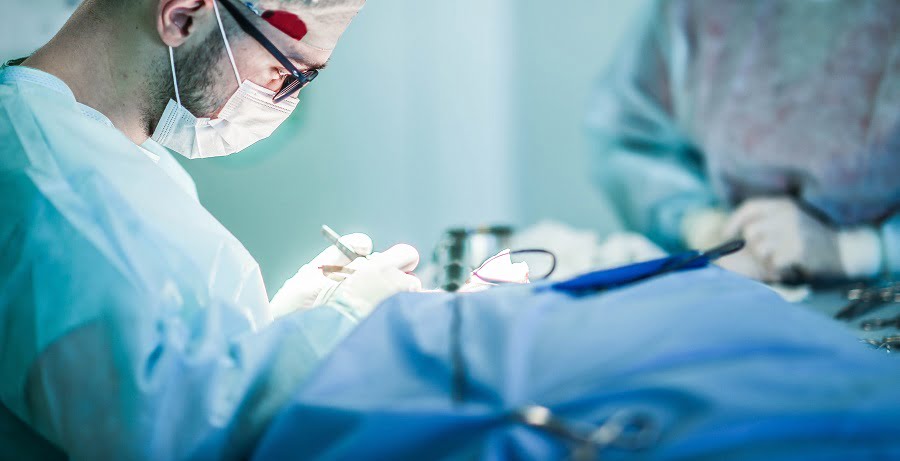 Young male plastic surgeon operates in the operating room | NY